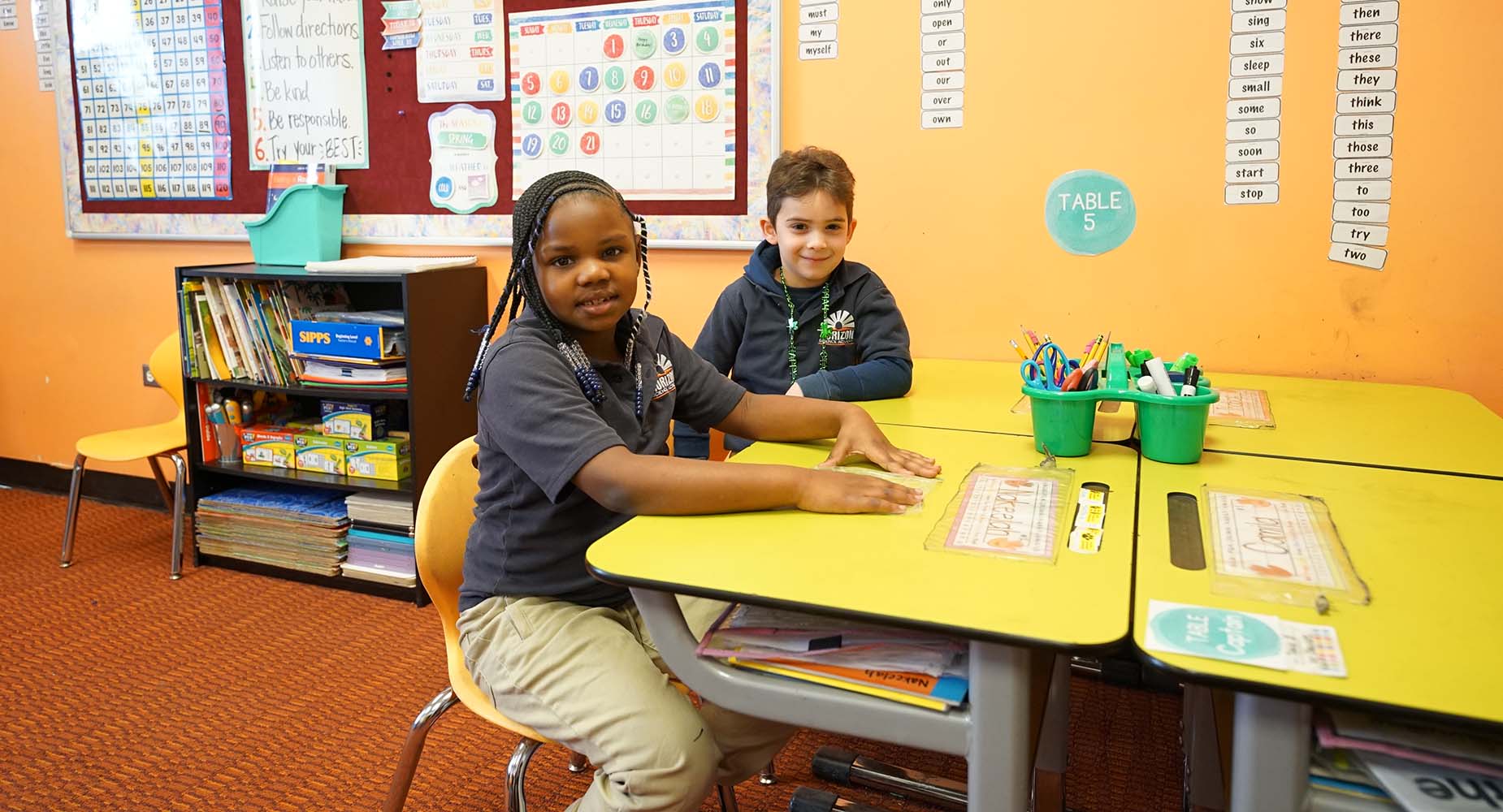 Teacher helping student