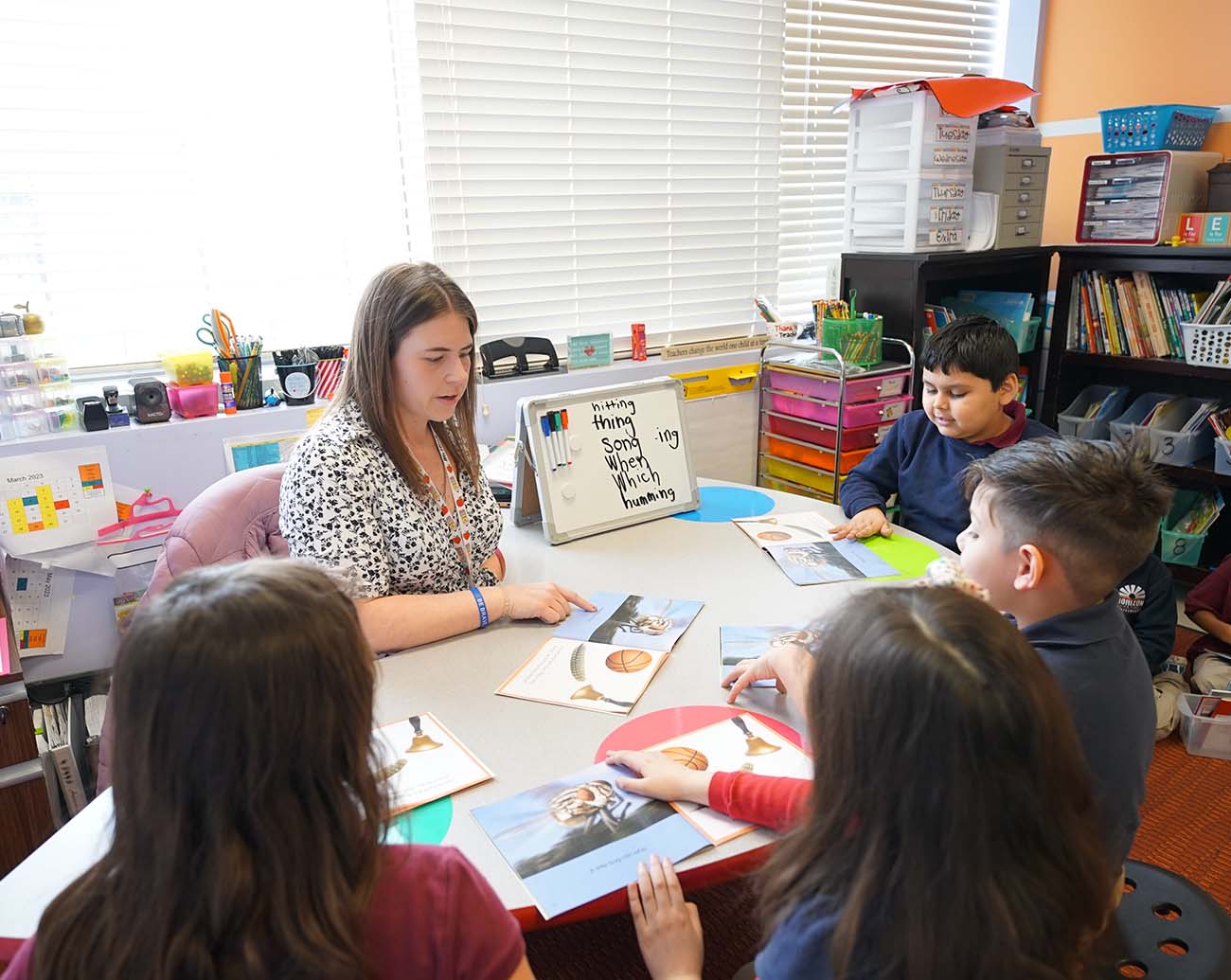 Teacher or school staff member warmly interacting with a student outside