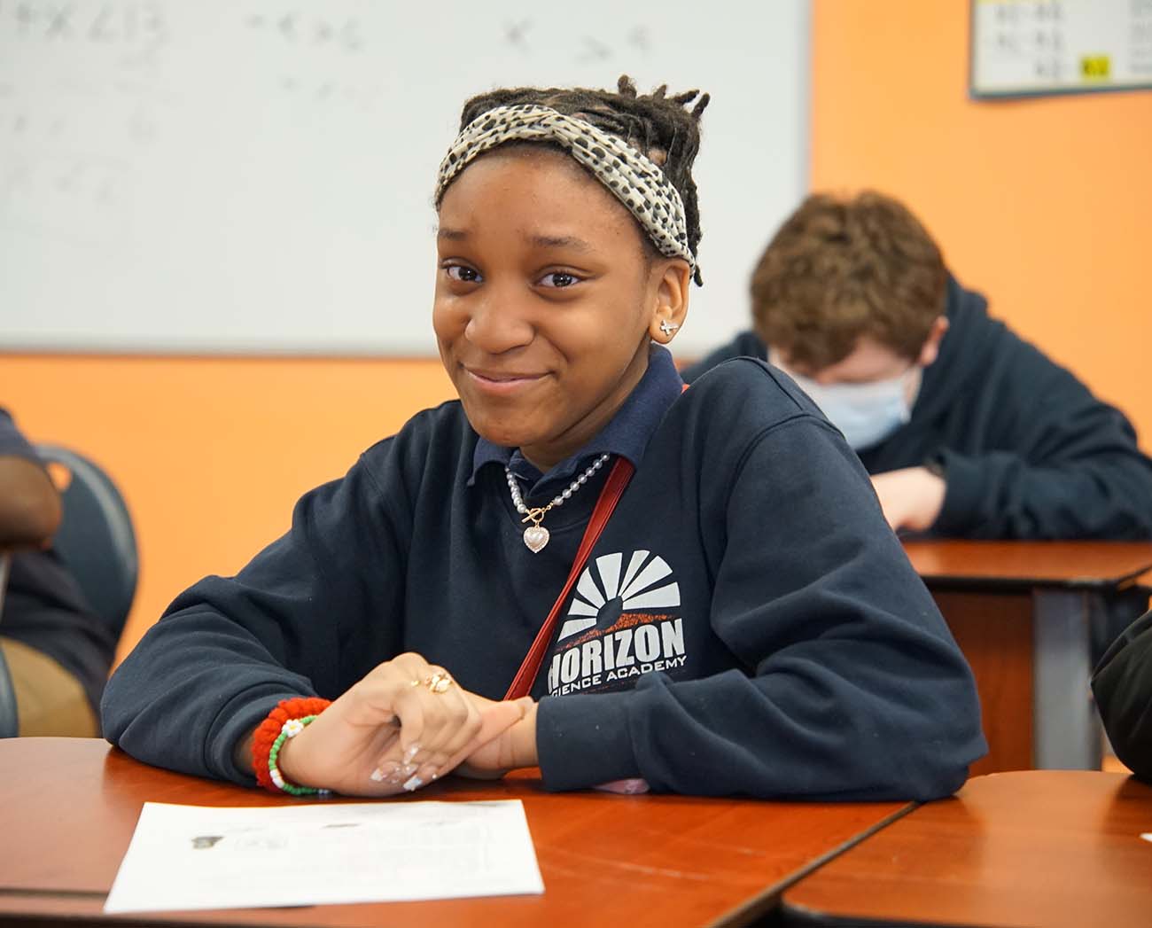 Smiling children together outdoors.